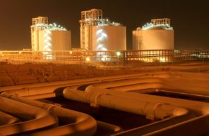 Facilities at phases 2-3 of the South Pars gas field, owned jointly by Iran and Qatar, are illuminated at night in Assaluyeh on Iran’s Persian Gulf coast, May 27, 2006. REUTERS/Morteza Nikoubazl