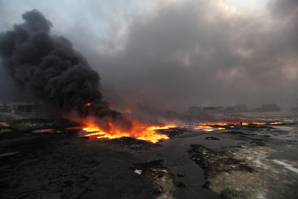 Oil Fires Cast Black Cloud over Qayyara Retaken from ISIS