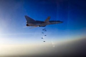 An image provided by Russia's Defense Ministry shows a Russian Tu-22M3 dropping bombs over Aleppo, Syria, on Tuesday
