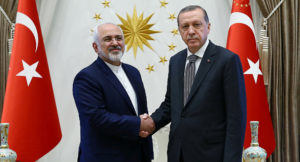 Turkey’s President Recep Tayyip Erdogan shakes hands with Iranian Foreign Minister Mohammed Javad Zarif (L) as they meet at the Presidential Palace in Ankara, Turkey, August 12, 2016