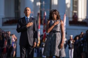 President Barack Obama and First Lady Michelle Obama stand in front of the White House as taps is played on the 4th anniversary of the September 11terrorist attack.-Getty Images