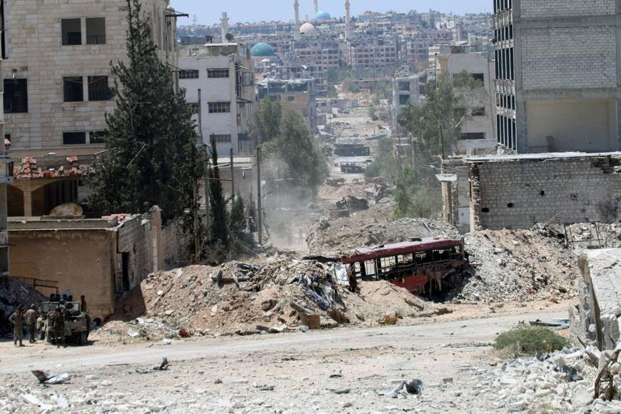Syria’s Ceasefire: Cautious Calm as Tanks Fire Shells on Aleppo Countryside