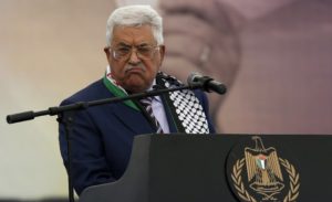 Palestinian Authority president Mahmoud Abbas gestures as he gives a speech during a rally marking the 12th anniversary of the death of late Palestinian leader Yasser Arafat in the West Bank city of Ramallah on November 10, 2016.