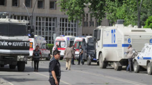 Police officers secure the area after an explosion in front of the city's police headquarters in Gaziantep