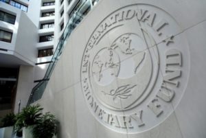 The International Monetary Fund (IMF) logo is seen inside its headquarters at the end of the IMF/World Bank annual meetings in Washington