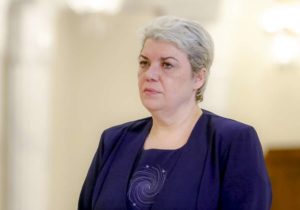 In this photo taken May 20, 2015, Sevil Shhaideh, 52, stands at the Romanian presidency before being sworn in as regional development minister in Bucharest, Romania.