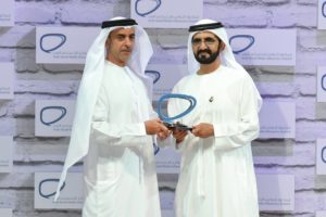 Sheikh Mohammed bin Rashid, Vice President and Ruler of Dubai, presents Sheikh Saif bin Zayed, Minister of Interior and Deputy Prime Minister, with the award for the category of individuals representing the public sector in the second Arab Social Media Influencers Summit.