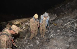 Pakistani soldiers search for victims from the wreckage of the crashed PIA passenger plane Flight PK661 (AFP)