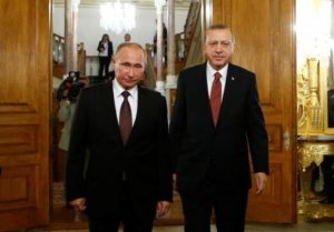Russian President Putin and his Turkish counterpart Erdogan arrive for a joint news conference following their meeting in Istanbul