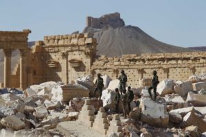 Syrian army soldiers stand on the ruins of the Temple of Bel in the historic city of Palmyra. Reuters: Omar Sanadiki, file photo