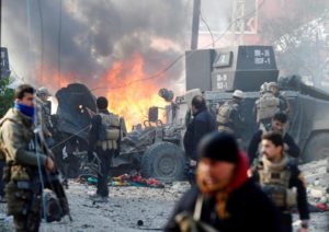 Iraqi Special Operations Forces (ISOF) react after a car bomb exploded during an operation to clear the al-Andalus district of Islamic State militants, in Mosul, Iraq, January 16, 2017.