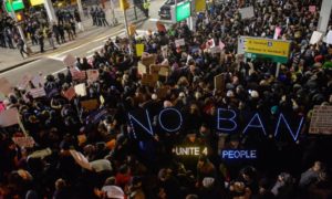 Protests outside Terminal 4 at JFK airport where two Iraqis were detained despite holding valid visas Getty Images
