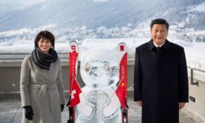 Swiss Federal President Doris Leuthard (left) poses with China’s President Xi Jinping (right) during the launch of the Swiss-Sino year of tourism next to a panda ice sculpture on the side line of the 47th annual meeting of the World Economic Forum, WEF, in Davos, Switzerland, 17 January 2017.