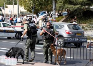 Israeli police secure the area following a shooting incident in what an Israeli police spokesperson described as a terrorist attack, near police headquarters in Jerusalem