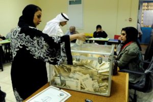 A Kuwaiti woman casts her vote during parliamentary election in a polling station in Kuwait City, Kuwait November 26, 2016. REUTERS/Stringer/File Photo FOR EDITORIAL USE ONLY. NO RESALES. NO ARCHIVES