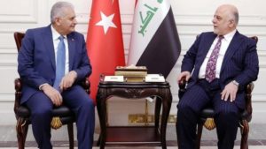A handout picture released by the Iraq Prime Minister's Press Office on January 7, 2017, shows Iraqi Prime Minister Haidar al-Abadi (R) meeting with his Turkish counterpart Binali Yildirim in the capital Baghdad.
