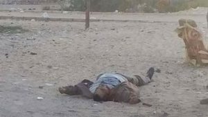 This photo, taken from the site of a militant attack on a checkpoint in the city of al-Arish, shows an unidentified person lying on the ground, Egypt, January 9, 2017.