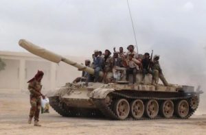 Southern People's Resistance militants loyal to Yemen's President Abd-Rabbu Mansour Hadi move a tank from the al-Anad air base in the country's southern province of Lahej