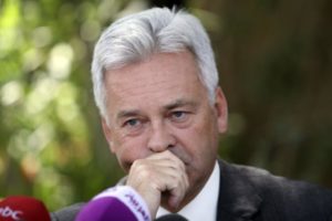 Alan Duncan reacts during a joint news conference with Mohammed Saeed al-Saidi and Geert Cappelaere in Sanaa