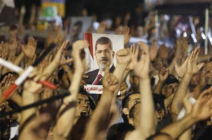 Members of the Muslim Brotherhood and supporter of ousted Egyptian President Mohamed Mursi shouts slogans at the Raba El-Adwyia mosque square in Cairo July 4, 2013.