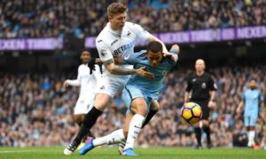 Mawson battles with the Manchester City forward Gabriel Jesus during Swansea’s 2-1 defeat at the Etihad.
