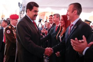 Venezuelan President Nicolas Maduro shook hands with new Vice President Tarek El-Aissami, right, at a meeting with ministers in Caracas. Reuters