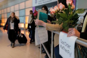 Opponents of U.S. President Donald Trump's executive order travel ban greet international travelers at Logan Airport in Boston, Massachusetts, U.S. February 3, 2017.