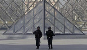 French police secure the site near the Louvre Pyramid in Paris, France, February 3, 2017 after a French soldier shot and wounded a man armed with a machete and carrying two bags on his back as he tried to enter the Paris Louvre museum.