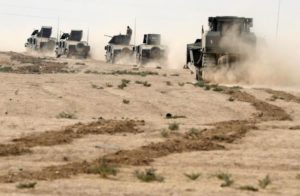 Iraqi special forces soldiers drive in a desert near Mosul, Iraq October 25, 2016.