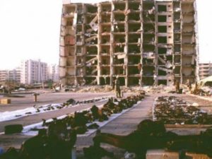 US and Saudi investigators spread debris on plastic sheets as they gather evidence after the June 25, 1996, bombing outside the Khobar Towers complex in Dhahran, Saudi Arabia. PHOTO: AFP