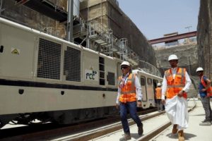 Workers walk at the site of the under-construction Riyadh Metro rail system in the Saudi capital Riyadh August 26, 2015.