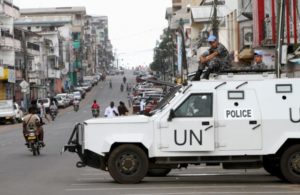U.N. peacekeepers patrol in their vehicle during Liberia's presidential election run-off, along a street in Monrovia