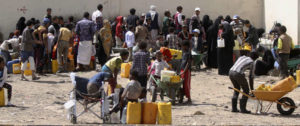 April 20, 2015: People queue to fill containers with water amid an acute shortage of clean drinking water in Sana'a. Mohamed al-Sayaghi/Reuters