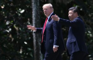 U.S. President Trump and China's President Xi walk together at the Mar-a-Lago estate after a bilateral meeting in Palm Beach