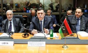 Serraj, President of the Presidency Council of the Government of National Accord of Libya sits next to Libya's Foreign Minister Siala and Interior Minister El Khoja during a meeting in Rome