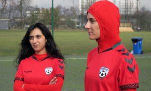 The former Afghanistan captain Khalida Popal with current Afghanistan player Shabnam Mabarz, who is wearing the new head-to-toe outfit with an integrated hijab. Photograph: Jan M. Olsen/AP