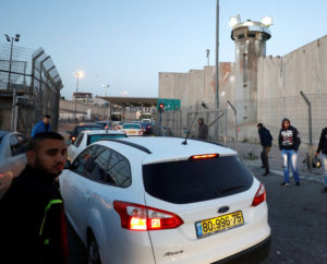 Palestinians waiting to pass through an Israeli checkpoint near the West Bank city of Ramallah.