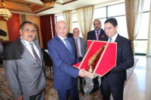 Ageela Saleh, accompanied by Libyan ambassador Abdulmajed Seif El Nasr (left), presented by Moroccan foreign minister Nasser Bourita with a trophy to mark his visit, Libya