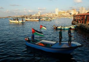 Palestinians stand atop a boat at Gaza seaport in Gaza City.