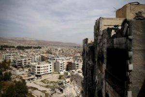 A general view shows damaged buildings as seen from the rebel held Qaboun neighborhood of Damascus
