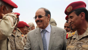 Yemeni Vice President General Ali Mohsen al-Ahmar (C) shakes hands with army officers as he visits military barracks in the eastern city of Marib on August 15, 2016.