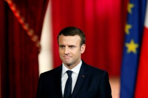 French President Emmanuel Macron listens during his inauguration at the handover ceremony at the Elysee Palace in Paris