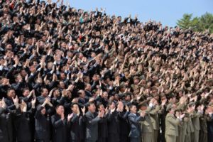 North Korean scientists and technicians, who developed missile "Hwasong-12" cheer North Korean leader Kim Jong Un
