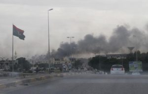 Smoke rises during heavy clashes between rival factions in Tripoli