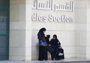 Women rest after casting their votes at a polling station during municipal elections, in Riyadh, Saudi Arabia