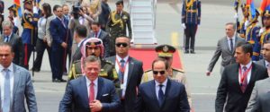 In this photo provided by Egypt's state news agency, MENA, Egypt's President Abdel-Fattah el-Sissi, center right, welcomes Jordan's King Abdullah II, to Cairo International Airport, Egypt, Wednesday, May 17, 2017.