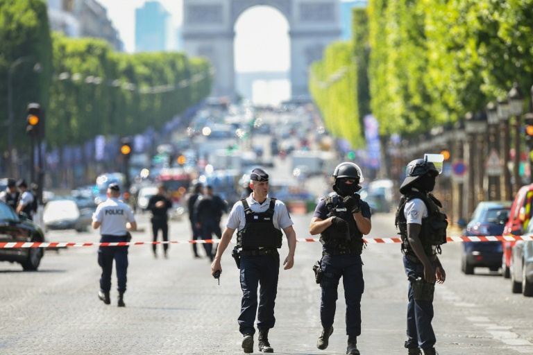 Driver Rams Explosives-Laden Car into Police Vehicle on Champs Elysees in Paris