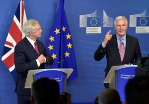 The European Union's chief Brexit negotiator Michael Barnier welcomes Britain's Secretary of State for Exiting the European Union David Davis ahead of their first day of talks in Brussels