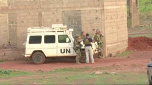 French soldiers stand around a United Nations vehicle following an attack where gunmen stormed Le Campement Kangaba in Dougourakoro, to the east of the capital Bamako