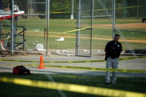 A police officer mans a shooting scene after a gunman opened fire on Republican members of Congress during a baseball practice in Alexandria, Virginia